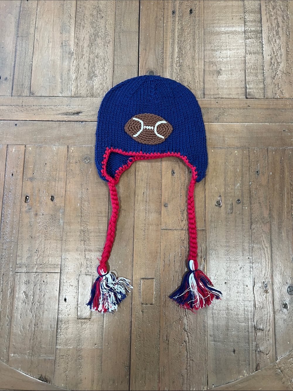 Huggalugs all American football beanie hat hand knit 2-6 years chin tie tassel